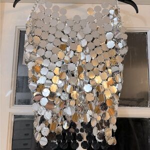 🩶🩶 This is a silver reflective tank top by 12th Tribe. 🩶🩶